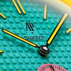 JeevzPlug Audemars Piguet x Swatch Royal Pop OTG Roz watch face featuring a textured teal Bioceramic dial and hands.