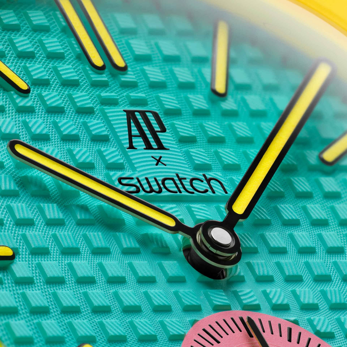 JeevzPlug Audemars Piguet x Swatch Royal Pop OTG Roz watch face featuring a textured teal Bioceramic dial and hands.