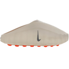JeevzPlug Nike Mind 001 Slide in Light Bone with a sculpted one-piece upper and vibrant orange traction outsole.