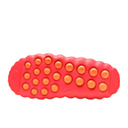 JeevzPlug Nike Mind 001 Slide in Solar Red showing the textured, circular-patterned outsole for grip.