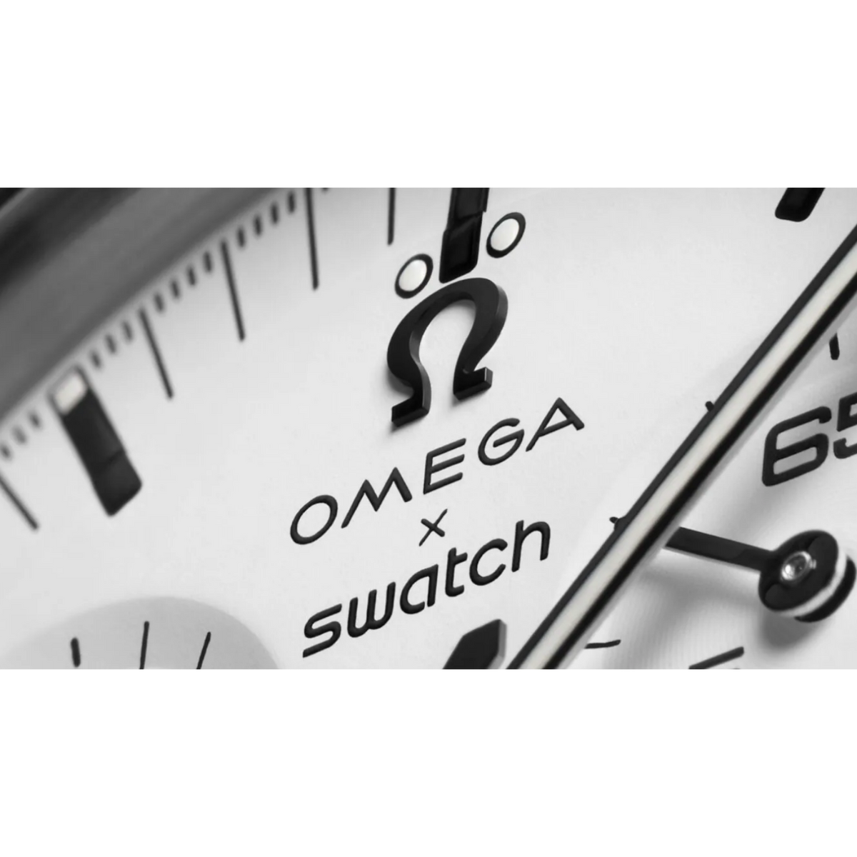 JeevzPlug Swatch x Omega Moonswatch 1965 white dial detail with iconic branding and black chronograph hands