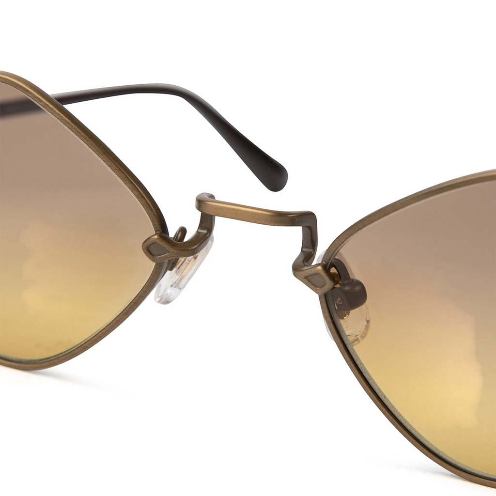 JeevzPlug Chrome Hearts Diamond Dog sunglasses featuring light brown lenses and a metallic frame bridge detail.