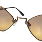 JeevzPlug Chrome Hearts Diamond Dog sunglasses featuring light brown lenses and a metallic frame bridge detail.