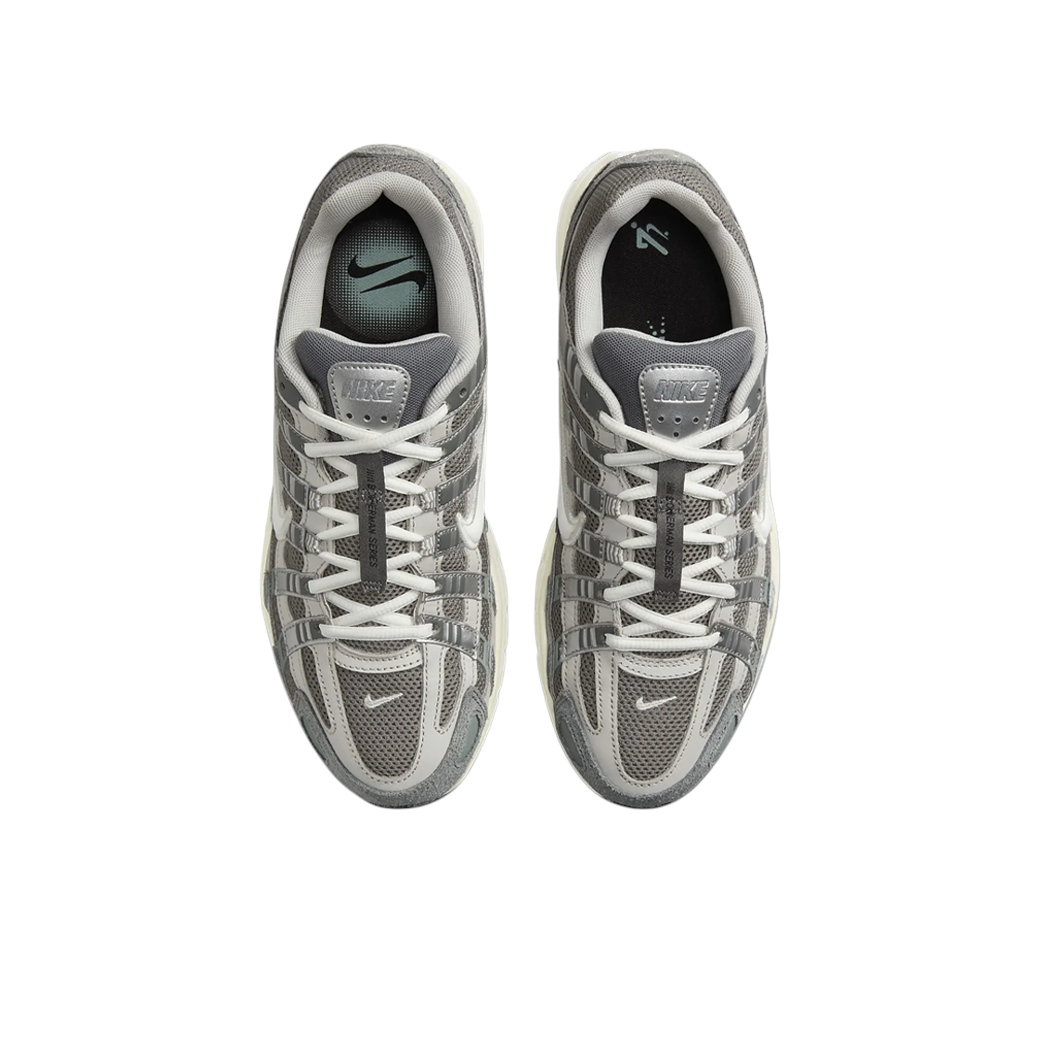 JeevzPlug Nike P-6000 Flat Pewter sneakers in grey mesh and metallic silver leather with cushioned white midsoles