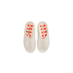 JeevzPlug Nike Mind 001 Slide in Light Bone with a perforated upper, contoured footbed, and orange circular accents.