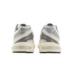 Rear view of JeevzPlug ASICS Gel-1130 women's sneakers in cream and clay grey with mesh and synthetic leather details.