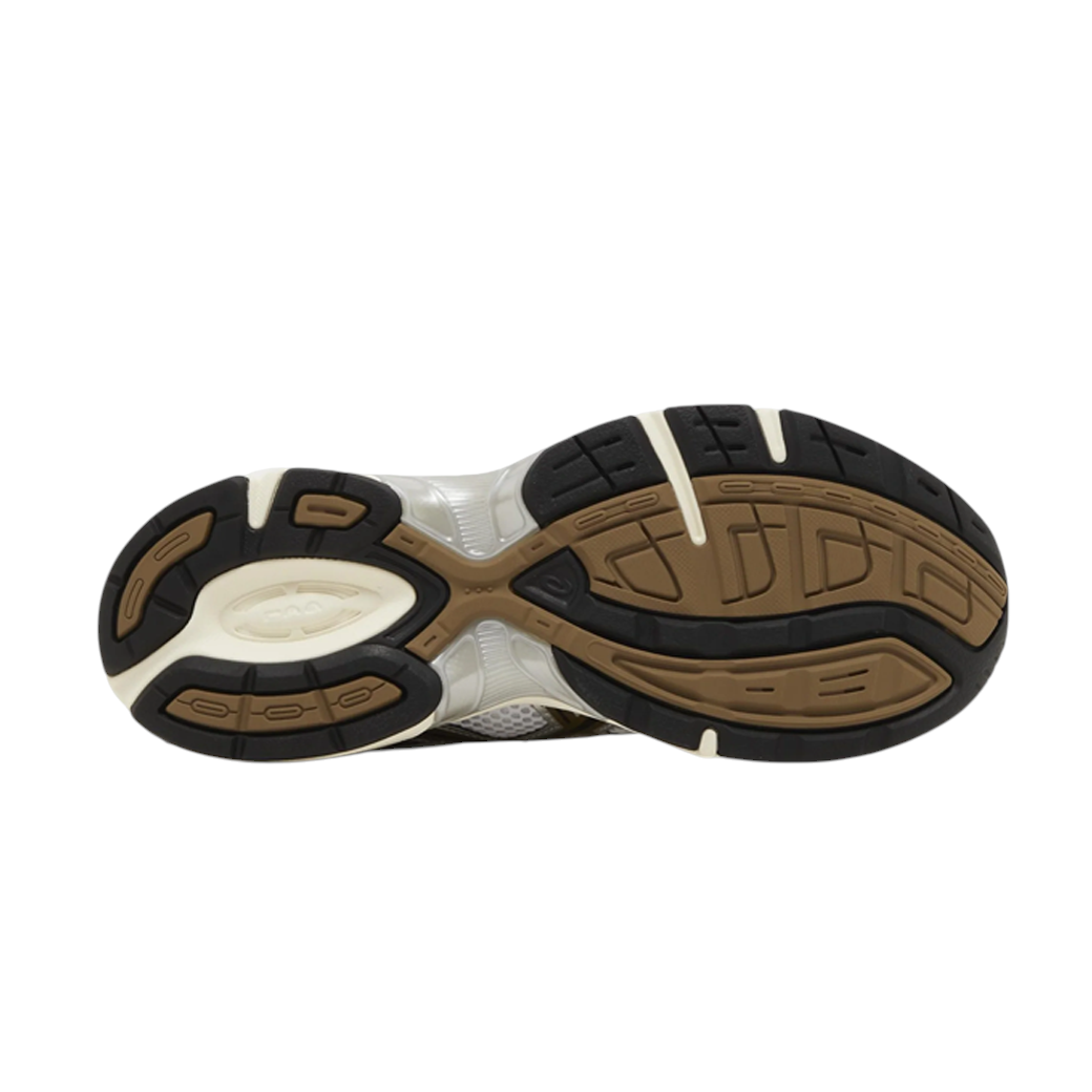 JeevzPlug ASICS Gel-1130 White Clay Canyon sneaker showing the black, brown, and white rubber traction outsole.