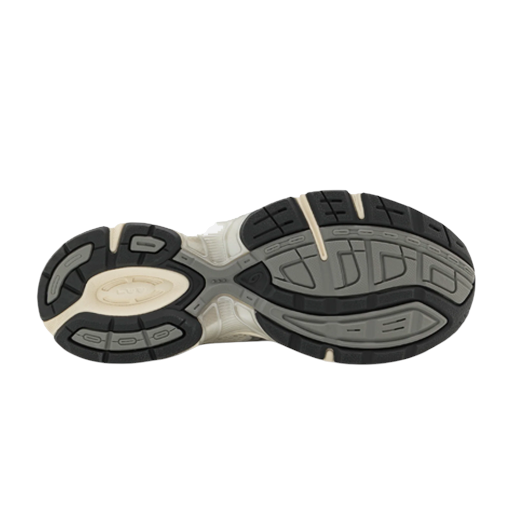 JeevzPlug ASICS Gel-1130 women's sneaker outsole in cream, clay, and grey with a durable rubber traction pattern.