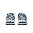 Rear view of JeevzPlug ASICS Gel-1130 sneakers in white and restful teal with metallic silver detailing.