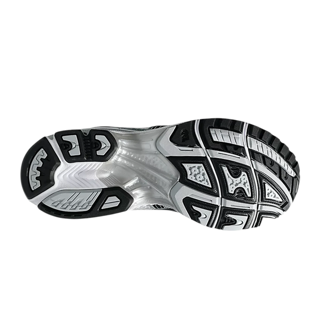 JeevzPlug ASICS Gel-Kayano 14 Fjord Grey sneaker showing the durable black and white rubber outsole tread pattern