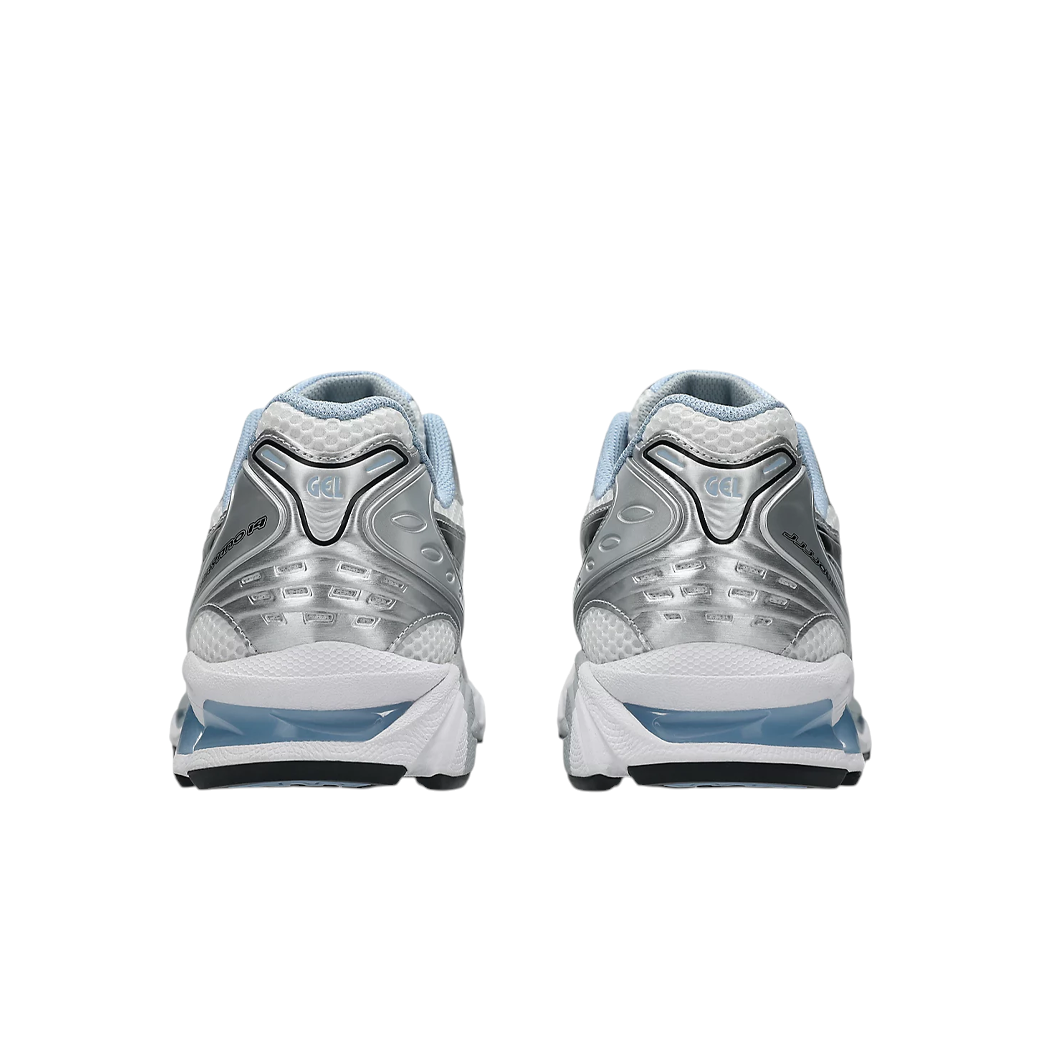 JeevzPlug JJJJound x ASICS Gel-Kayano 14 sneakers in white, metallic silver, and blue, rear view showing GEL cushioning.