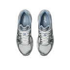 JeevzPlug JJJJound x ASICS Gel-Kayano 14 sneakers in white, metallic silver, and baby blue, top-down view.