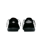 JeevzPlug Nike Air Jordan 1 Low Travis Scott Black Phantom sneakers showing mismatched bee and Wings logo heel embroidery