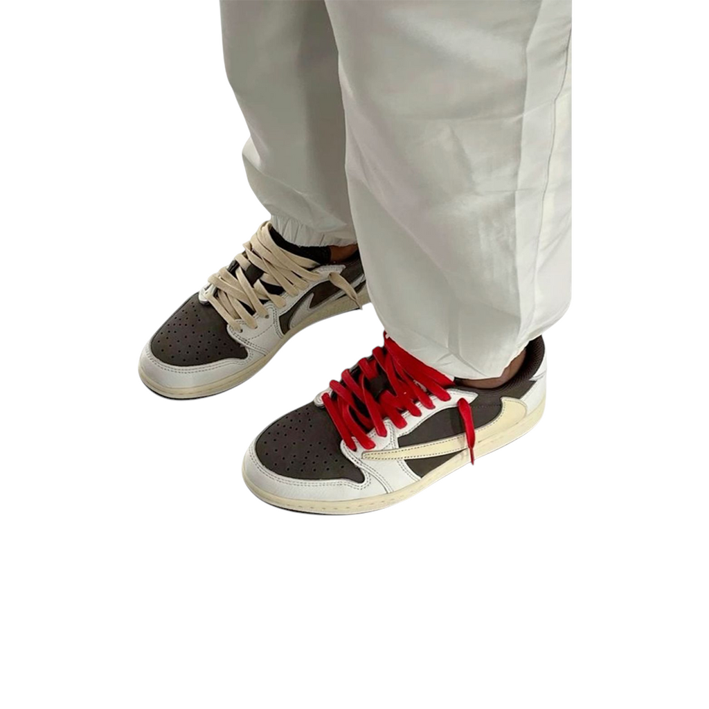 JeevzPlug Nike Air Jordan 1 Low Travis Scott Reverse Mocha sneakers with brown suede and cream leather on feet