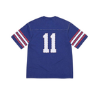 Back view of the blue JeevzPlug Supreme studded football jersey featuring white number 11 and striped sleeves