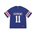 JeevzPlug Supreme blue short sleeve football jersey with white number 11, studded chest detail, and striped sleeves.