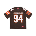 JeevzPlug Supreme brown sequin football jersey with white number 94 and athletic mesh detailing.