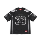 JeevzPlug Supreme Wings football jersey in black poly eyelet mesh with white number 33 and wing graphic details.