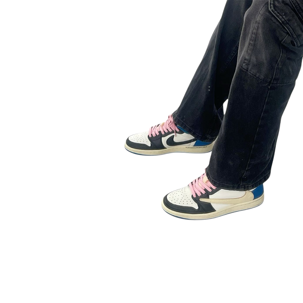 JeevzPlug Travis Scott x Air Jordan 1 Low Fragment sneakers with pink laces worn with black jeans