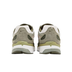 JeevzPlug Nike P-6000 Cargo Khaki sneakers, rear view showing olive green mesh, suede overlays, and white foam midsole.
