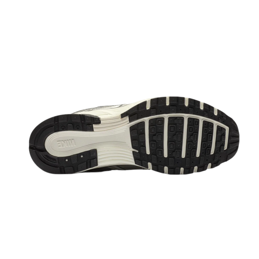 JeevzPlug Nike P-6000 Metallic Silver sneaker showing the durable black and white rubber outsole tread pattern.
