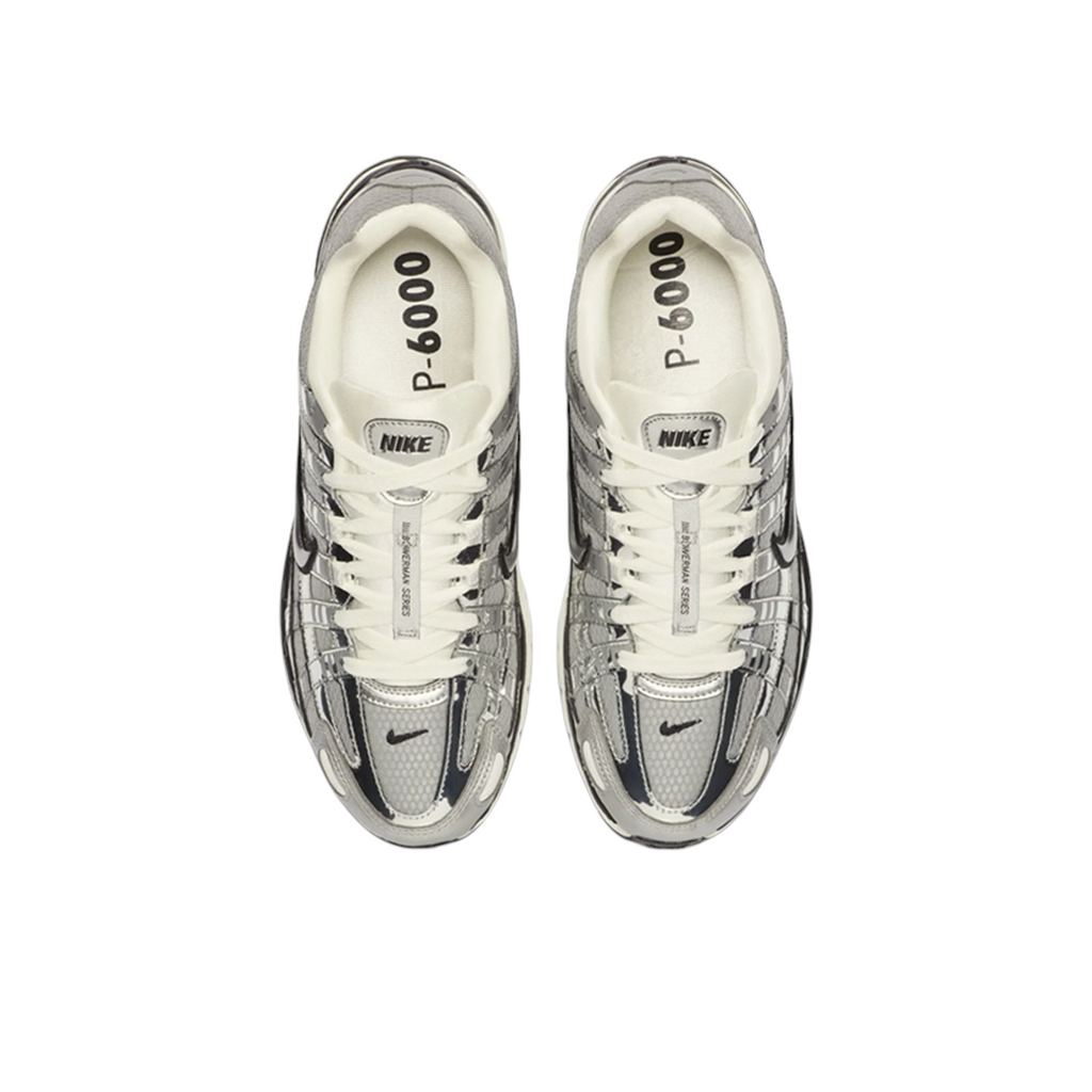 JeevzPlug Nike P-6000 Metallic Silver sneakers featuring chrome synthetic leather overlays and white laces, top view.