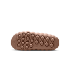JeevzPlug Nike Mind 001 Slide in Sand Drift featuring a textured, molded rubber outsole with circular grip nodules.
