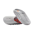 JeevzPlug Nike Mind 001 Slide in Light Smoke Grey with a sculpted one-piece upper and orange footbed detailing.