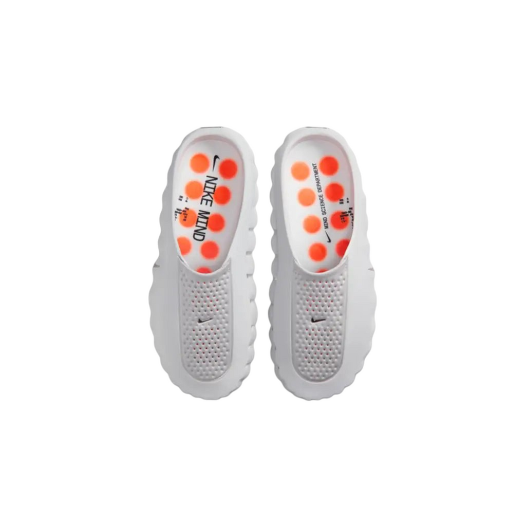 JeevzPlug Nike Mind 001 Slide in Light Smoke Grey with a perforated upper and orange circular footbed detailing.