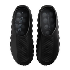 JeevzPlug Nike Mind 001 Slide in triple black with a molded one-piece upper, textured footbed, and minimalist design.