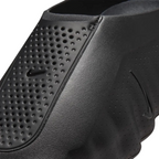 JeevzPlug Nike Mind 001 Slide in triple black featuring a molded upper with perforated detailing and a tonal swoosh.