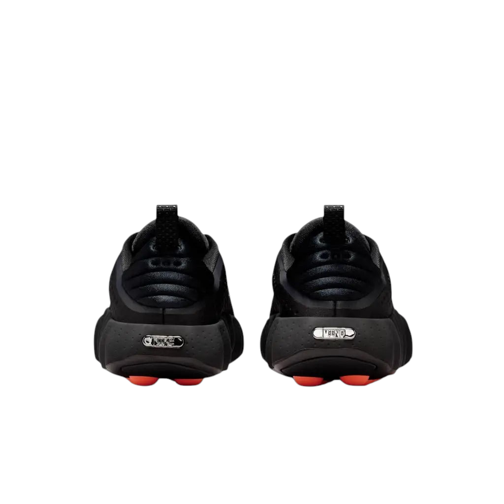 JeevzPlug Nike Mind 002 Black sneakers showing the rear view with chrome detailing and orange outsole accents.