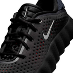 JeevzPlug Nike Mind 002 Black Chrome sneaker featuring a perforated upper, metallic swoosh, and sculpted midsole.