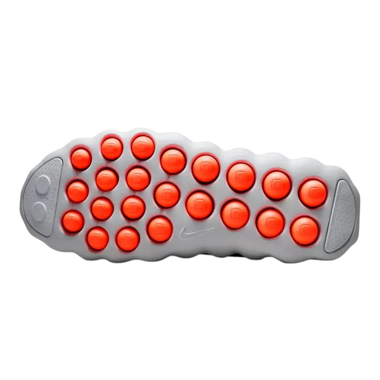 JeevzPlug Nike Mind 002 Light Smoke Grey sneaker outsole featuring bright orange circular traction pods