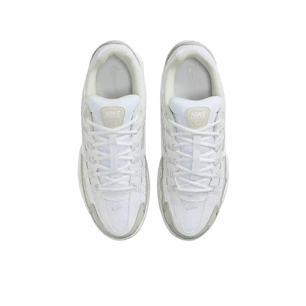JeevzPlug Nike P-6000 sneakers in white, sail, and vast grey with mesh upper and lace-up design, top-down view.
