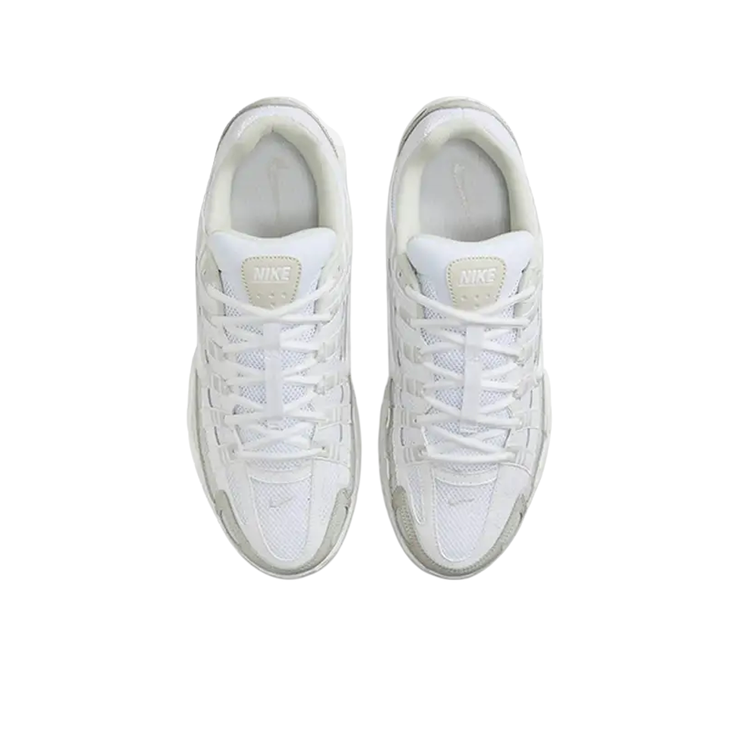 JeevzPlug Nike P-6000 sneakers in white, sail, and vast grey with mesh upper and lace-up design, top-down view.