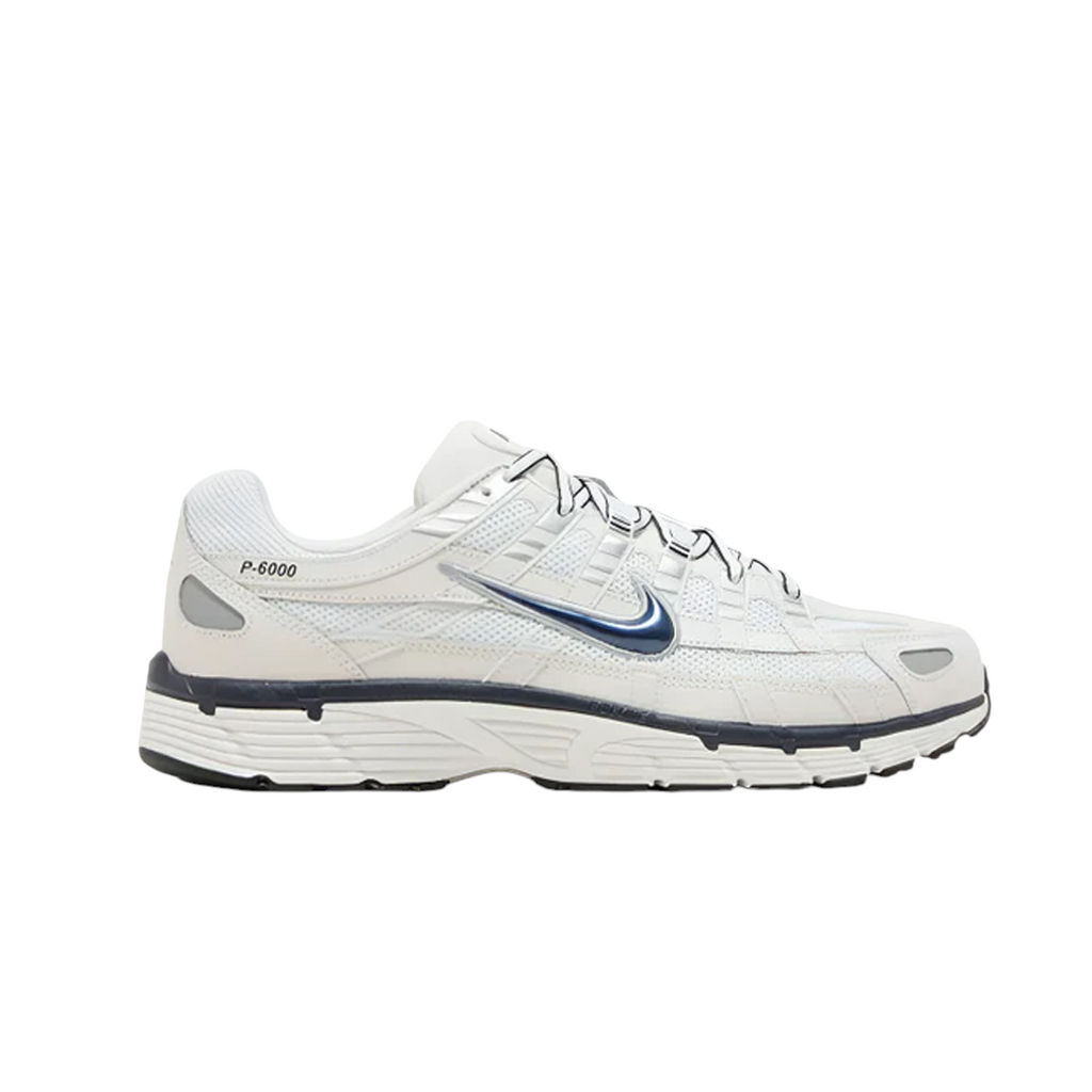 JeevzPlug Nike P-6000 sneaker in phantom mesh and white leather with obsidian blue accents and retro running design.