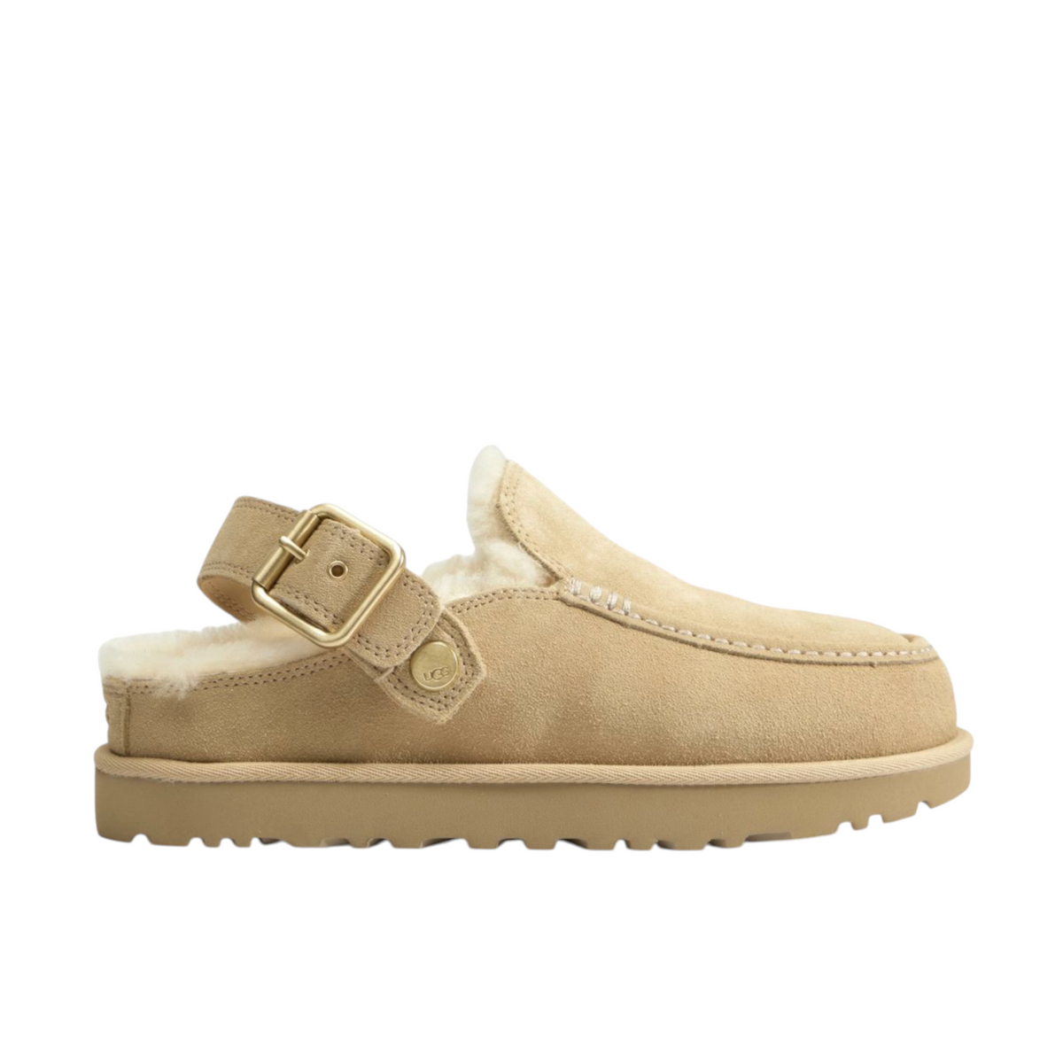 JeevzPlug UGG Goldenstar Evelina clog in sand castle beige suede with a gold buckle strap and plush shearling lining