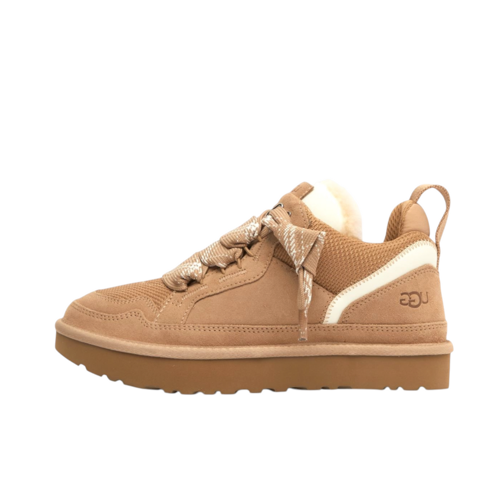 JeevzPlug UGG Lowmel Trainer in sand suede with thick laces, plush lining, and a chunky platform sole.