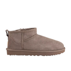 JeevzPlug UGG Ultra Mini Caribou boots in brown suede with plush lining and rear pull tab, side profile view.