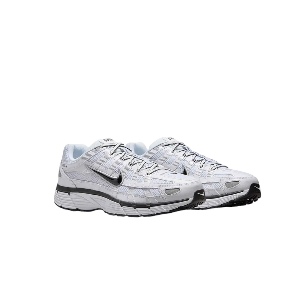 JeevzPlug Nike P-6000 sneakers in white mesh with metallic silver and black leather overlays and a foam midsole.