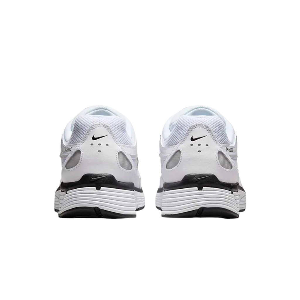 JeevzPlug Nike P-6000 sneakers in white, metallic silver, and black, shown from the rear view.