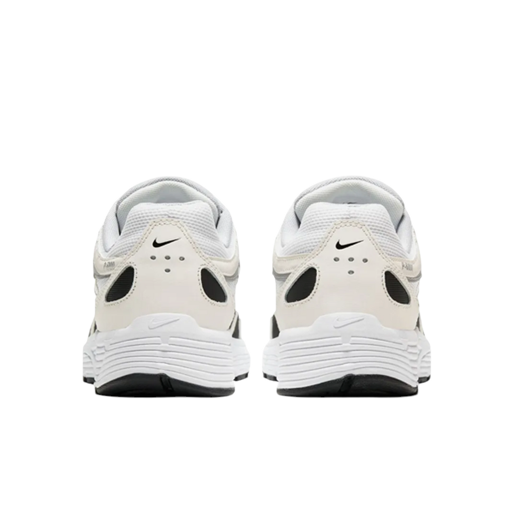JeevzPlug Nike P-6000 Sail Wolf Grey sneakers showing the white heel counters with black Swoosh logos and perforations