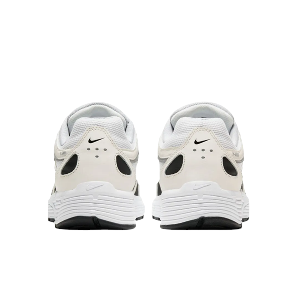JeevzPlug Nike P-6000 Sail Wolf Grey sneakers showing the white heel counters with black Swoosh logos and perforations