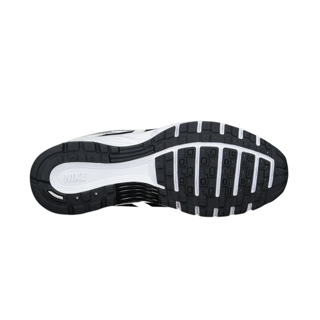 JeevzPlug Nike P-6000 Sail Wolf Grey sneaker showing the black and white rubber traction outsole from below.