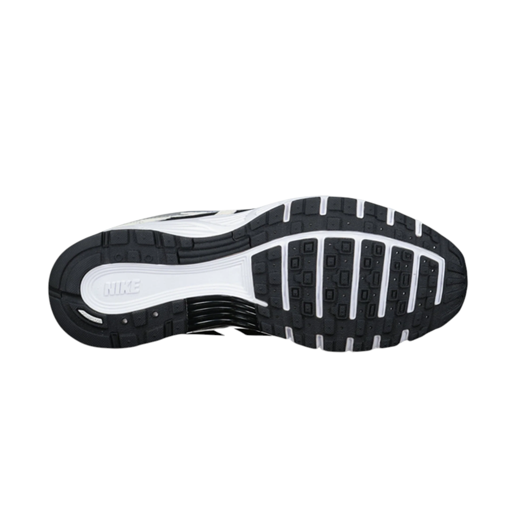 JeevzPlug Nike P-6000 Sail Wolf Grey sneaker showing the black and white rubber traction outsole from below.