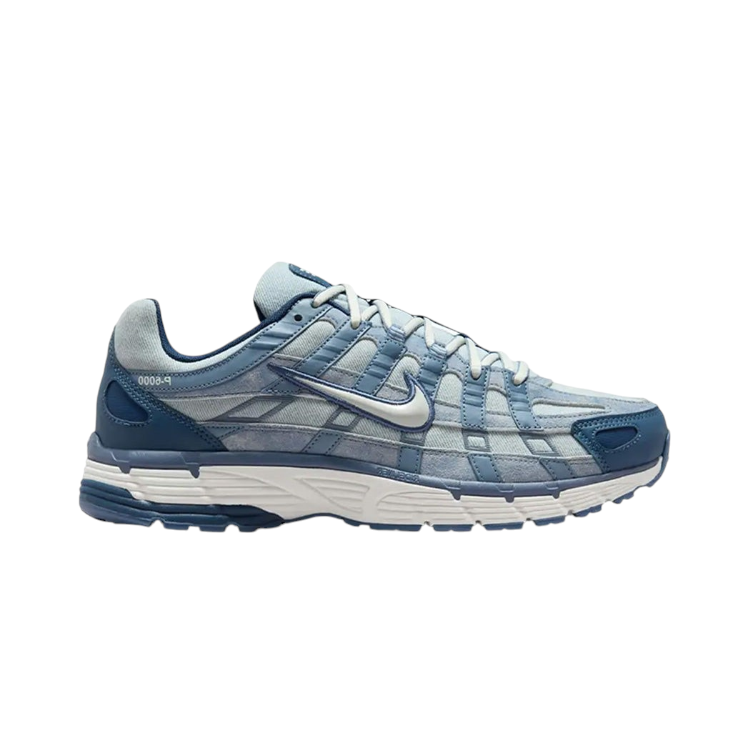JeevzPlug Nike P-6000 Worn Blue Denim sneakers featuring a blue denim upper with suede overlays and cream accents.